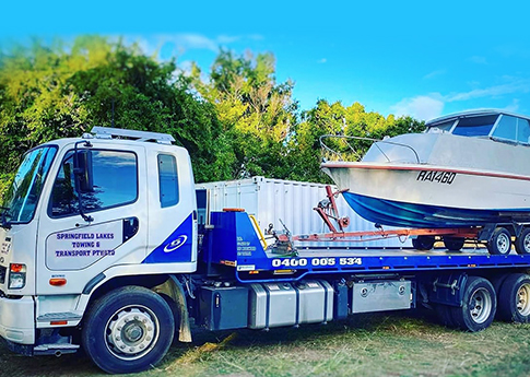 tow truck towing boat